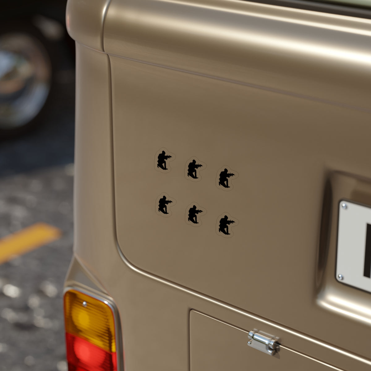 Beige vehicle with a logo on the back and a license plate on a blurred street background